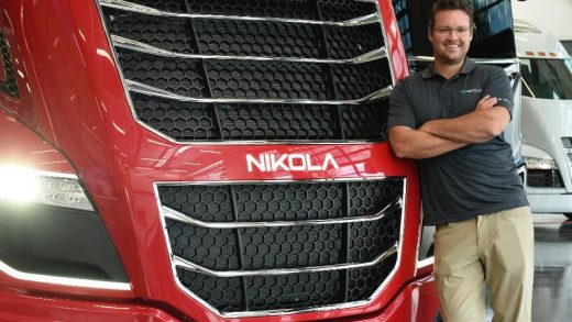 Nikola Motors billionaire CEO Trevor Milton standing in front of a hydrogen powered big rig truck