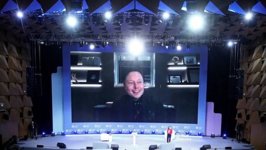 Elon Musk appearing via videolink at the New Knowledge forum in Moscow