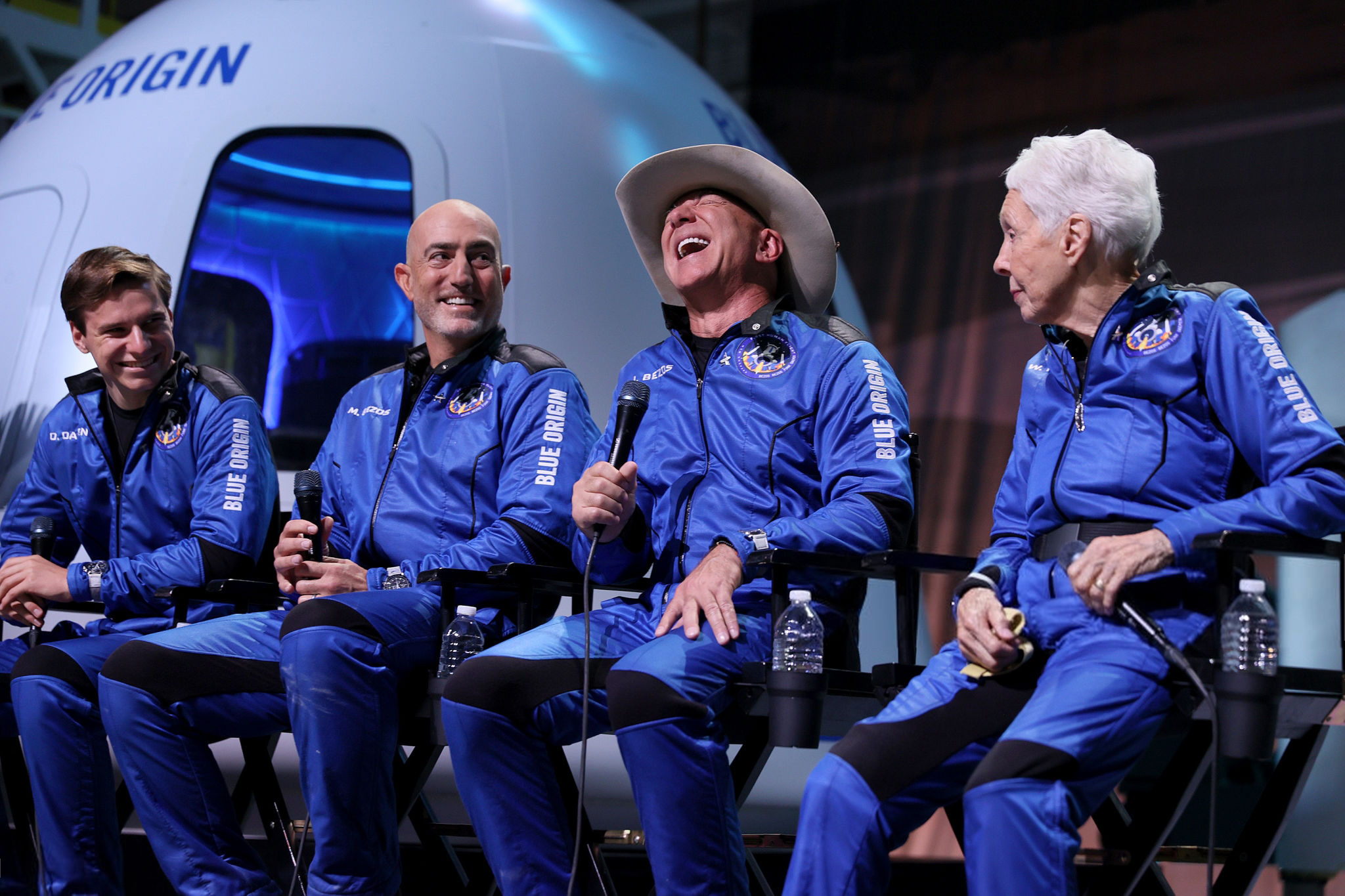 Jeff Bezos, center, with his brother, Mark Bezos, left, and Wally Funk, an aviator who became the oldest person to travel to space, after their Blue Origin flight on Tuesday in Van Horn, Texas.