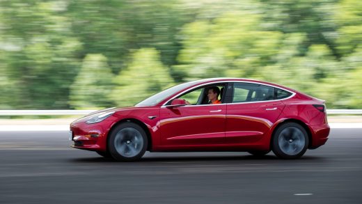 FILE PHOTO: Joe Young, media relations associate for the Insurance Institute for Highway Safety (IIHS), drives a 2018 Tesla Model 3 at the IIHS-HLDI Vehicle Research Center in Ruckersville, Virginia, U.S., July 22, 2019. Picture taken July 22, 2019. REUTERS/Amanda Voisard/File Photo